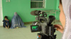 Jamila Emami filming at a clinic in Kandahar