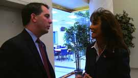 Gov. Scott Walker talks with billionaire Diane Hendricks, his largest campaign donor.