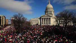 Protestors gather outside the Capitol building in Madison, WI.