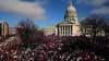 Protestors gather outside the Capitol building in Madison, WI.