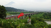 Akito Kawahara waits for butterflies.  Mt Fuji looks on.