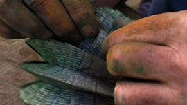 Hands getting dirty while folding