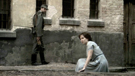 Hannah Senesh (Meri Roth) in a prison courtyard