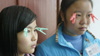 To avoid getting fined for falling asleep, Jasmine (17) and Li Ping (14) use clothespins to keep their eyes open.