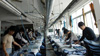 Workers ironing at the jeans factory