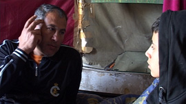 Ibrahim talks with his son Machmod