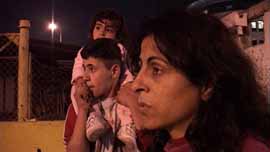 Yusra, Machmod, and his sister on the street