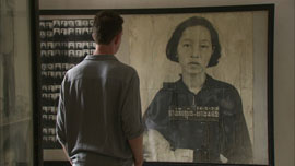 Nic Dunlop in the Tuol Sleng gallery at photo of Chan Kim Srun Nic Dunlop in the Tuol Sleng gallery at photo of Chan Kim Srun