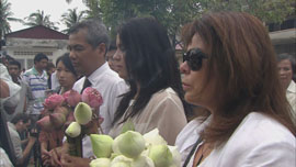 Families at a ceremony for the victims Families at a ceremony for the victims