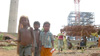 Tribal land is taken over by a British mining company as tribal children face camera.