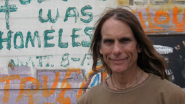 Jeffrey in front of graffiti van