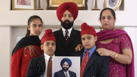 Rana Singh Sodhi with his wife Sukhbir and children who hold a photo of Balbir Singh Sodhi