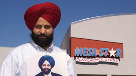 Rana Singh Sodhi stands in front of the gas station where his brother, Balbir Singh Sodhi was slain