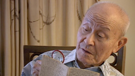 Paul Loong reading from his secret WWII diary