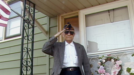 Paul Loong salutes prior to the Memorial Day Parade in Clark, NJ