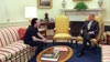 Bono meets with President Bill Clinton in the White House.