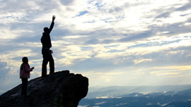 Solo and Alex on a cliff