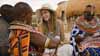 Olivia Wilde learns how to make beaded jewelery with women from Umoja Women's Village in Samburu, Kenya.