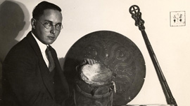 Melville J. Herskovits with various African objects 