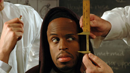 Reenactment featuring the measuring of young man's eyes and nose