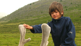 Rowan Isaacson on a reindeer in Mongolia Rowan Isaacson on a reindeer in Mongolia