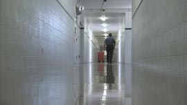 Mike Carpenter, chief of security at Lexington Prison, walks down the hallway on one of his shifts.