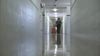 Mike Carpenter, chief of security at Lexington Prison, walks down the hallway on one of his shifts.