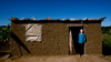 Vedastus in the doorway of his home, Ukerewe Island Tanzania.
