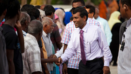President Mohamed Nasheed greets residents of an island in the northern Maldives.