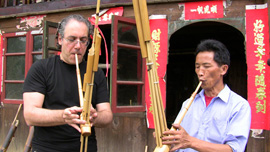 Stewart Wallace learned to play a lusheng from the master lusheng craftsman in the village of Paiya. Stewart Wallace learned to play a lusheng from the master lusheng craftsman in the village of Paiya.