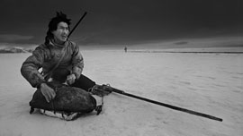 Ole with his gun ready to shoot a seal Ole with his gun ready to shoot a seal