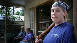 Specialist Shannon Morgan on her parents' porch in Mena, Arkansas