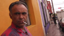 Augie Garcia outside the boarding house where he lived in downtown Guadalajara, Mexico	
