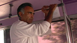 Augie Garcia riding a city bus in downtown Guadalajara, México