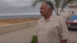Augie Garcia looks north to the U.S. border from his residence in Tijuana, México