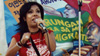 Garment worker Lupe Hernandez addresses the crowd at a rally