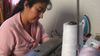 Garment worker Maria at a sewing machine