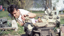 Mark Hogancamp setting up a scene in Marwencol