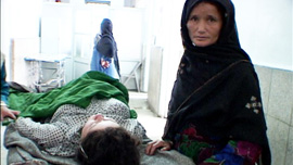 Mother of coma patient stands over her