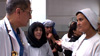 Dr. Mojadidi speaks with Dr. Mina and other hospital staff in the hallways at RBH