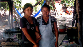 Salvador Garcia's wife and daughter at home, 2011.