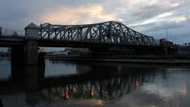 Wide shot of the Madison Avenue Bridge taken from the Manhattan side of the Harlem River
