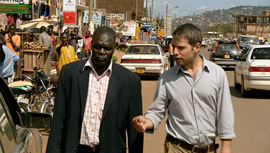 Johnnie Lacambel and Matthew Brubacher (from the ICC) are walking a busy road while having a conversation