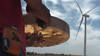 Native drummer celebrates the construction of a wind turbine