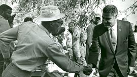 Whitney Young shaking hands on a southern tour
