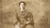 Loreta Velazquez (Romi Dias) poses for a portrait, dressed as a woman, played by Romi Diaz