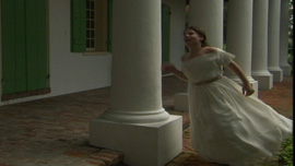 Young Loreta, played by Isabel Taysin Carter, runs through columns in her Cuban plantation home