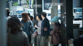 Two staff members from the company waits for a client.