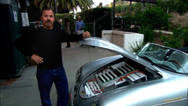 Greg "Gadget" Abbott showing the batteries in his converted car