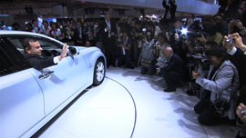 Carlos Ghosn in a Nissan LEAF at a press event